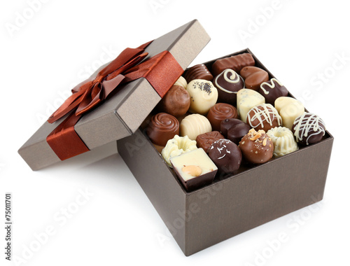 Delicious chocolate candies in gift box isolated on white