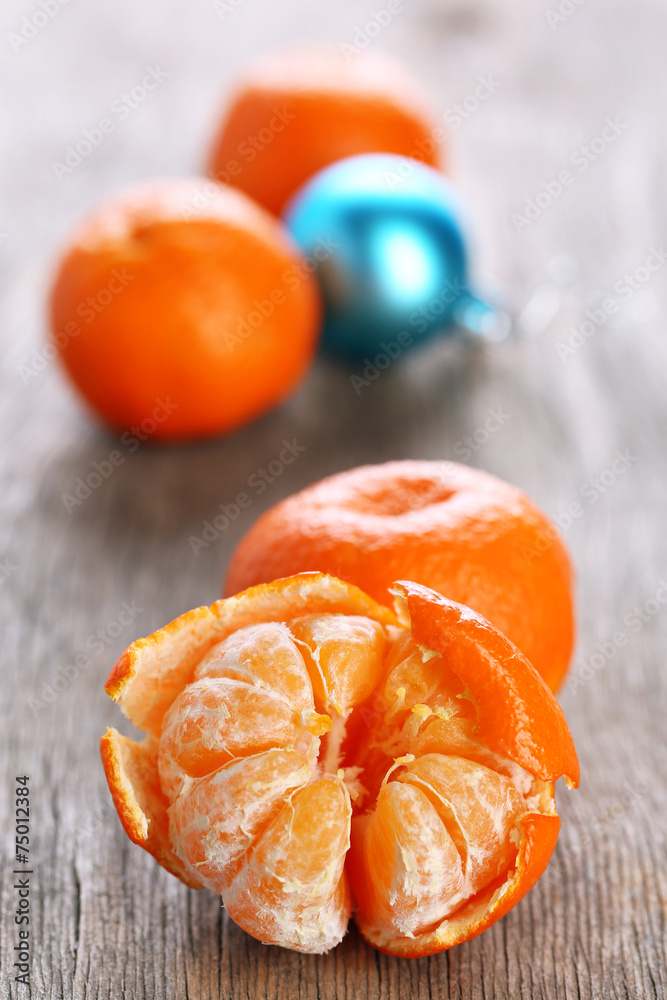 Fresh ripe mandarins and Christmas decoration background