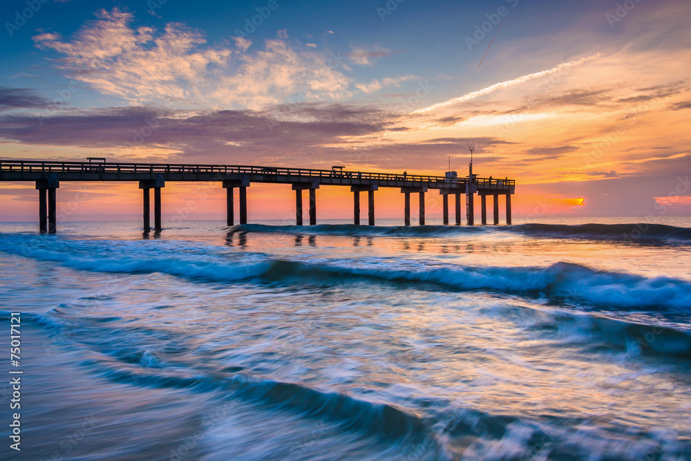 Waves on the Atlantic Ocean and fishing pier at sunrise, St. Aug