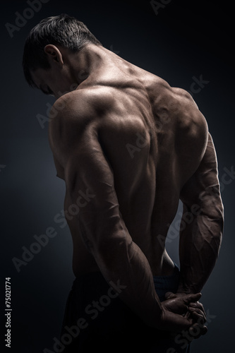 Samolepka Handsome muscular bodybuilder turned back