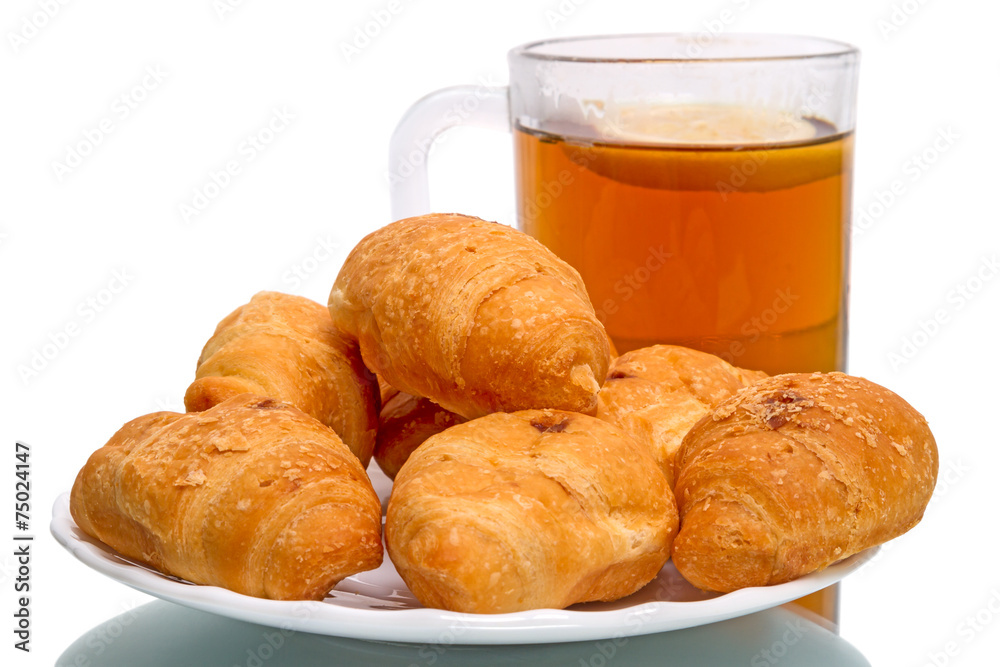 Tea with lemon and croissants