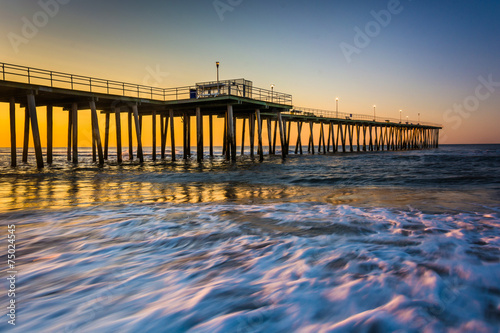Fishing pier and waves on the Atlantic Ocean at sunrise in Ventn