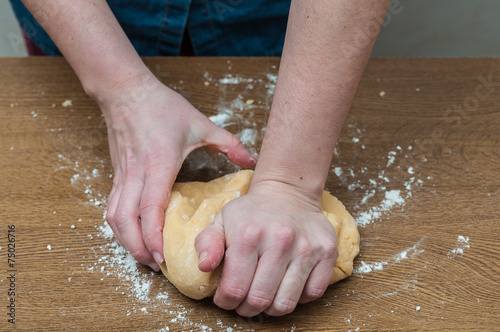 Woman kneading, baking cookies, pizza or bread