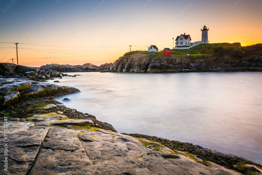Long exposure of the Atlantic Ocean and Nubble Lighthouse at sun