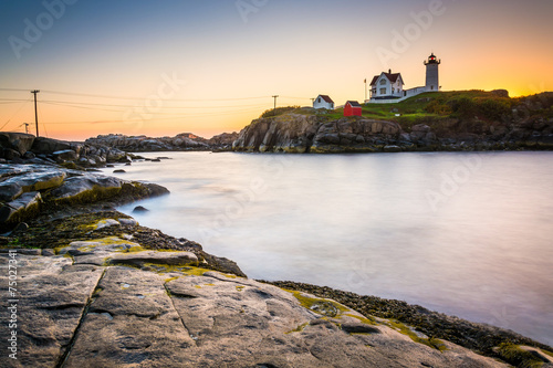 Long exposure of the Atlantic Ocean and Nubble Lighthouse at sun