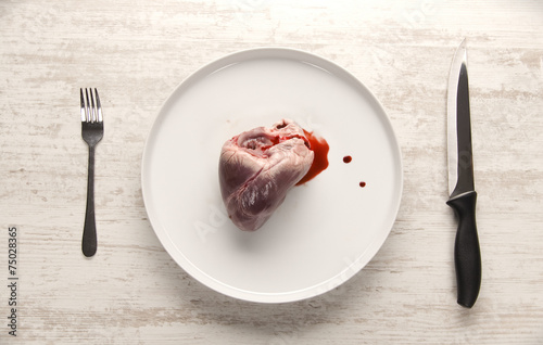 Fotografía Pork heart on a white plate