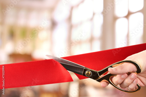 Grand opening, cutting red ribbon photo