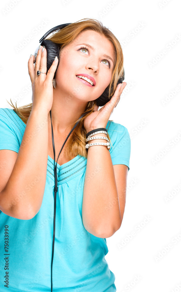 Beautiful girl with headphones isolated on a white background Beautiful girl with headphones isolated on a white background