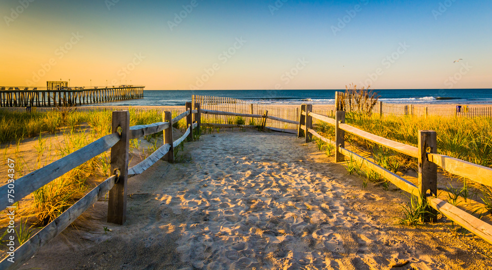 Path over sand dunes to the Atlantic Ocean at sunrise in Ventnor
