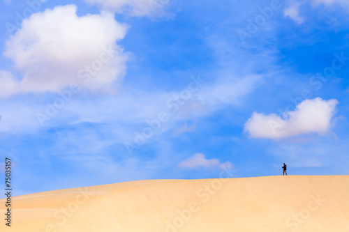 Sand dunes in Boavista desert with blue sky and clouds, Cape Ver