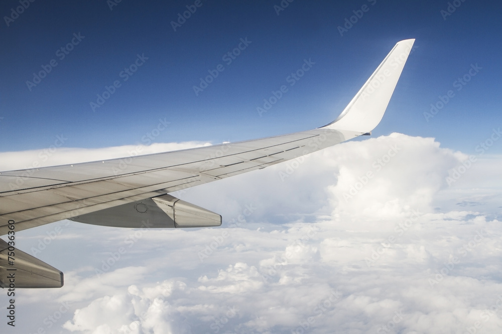 airplane wings in the blue clouds airplane wings in the blue clouds