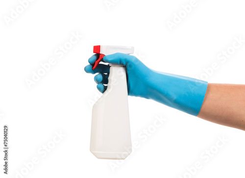 Hand holds spray bottle