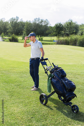 Young man playing golf