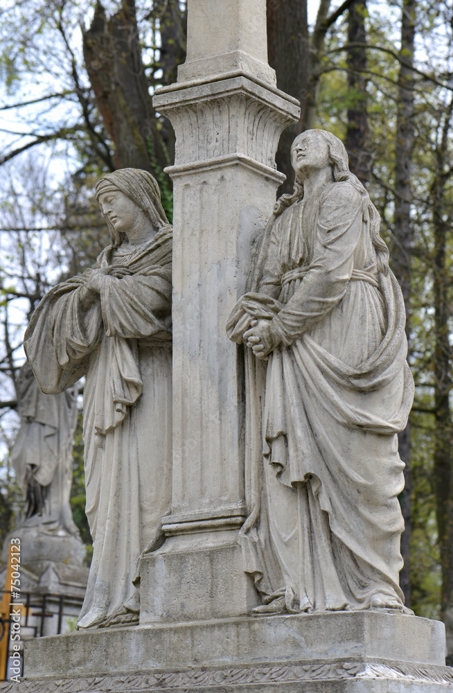 Fototapeta premium Old statue on grave