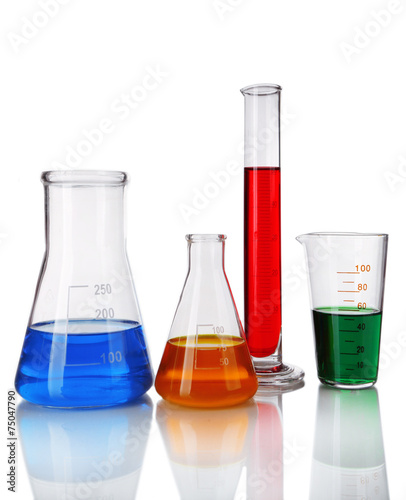 Test-tube and flasks with colorful fluid on light background