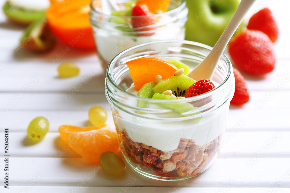 Healthy dessert with muesli and fruits on table Healthy dessert with muesli and fruits on table