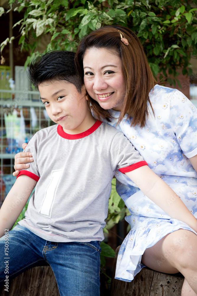 Asian woman talking about with your son in the park