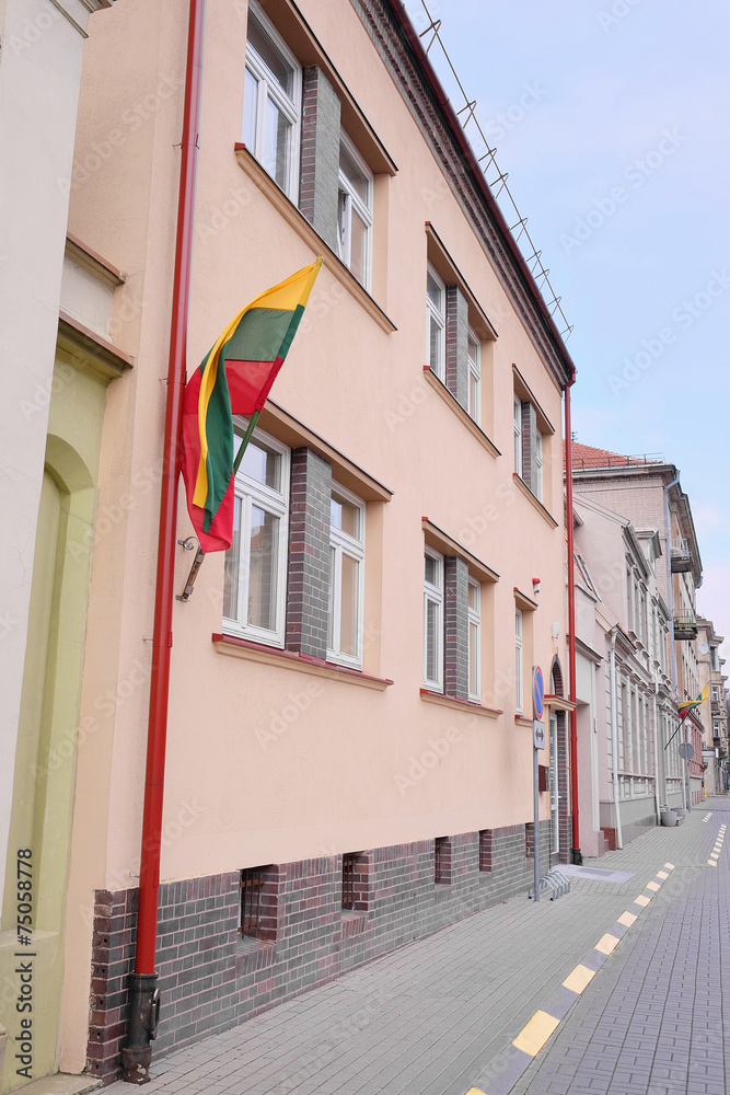Klaipeda, Lithuania, 2014: on the house hanging  national flag