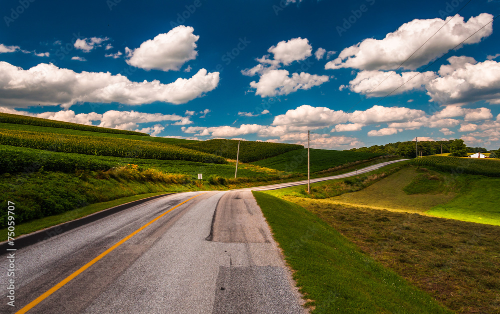 Beautiful summer clouds over a country road in rural York County