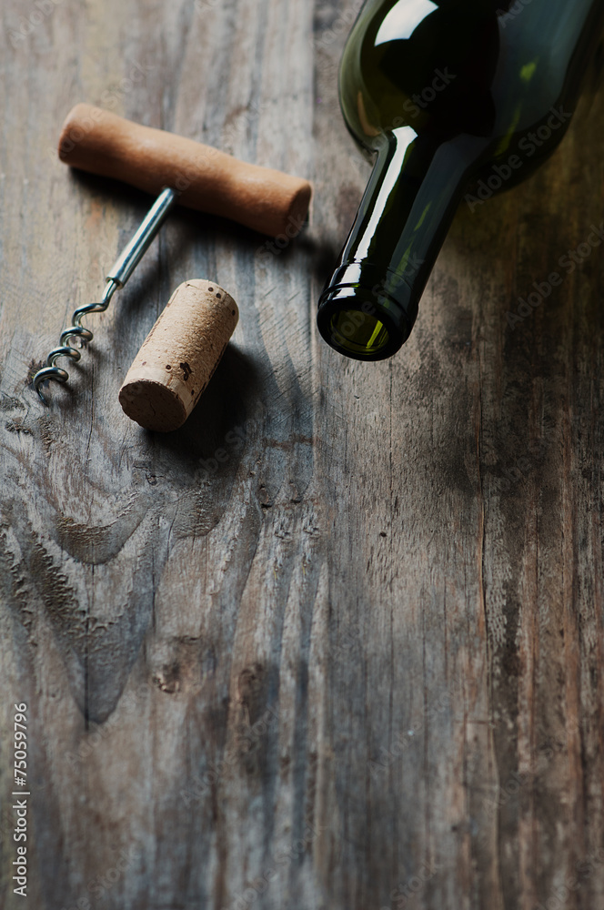 Bottle of wine, cork and corkscrew