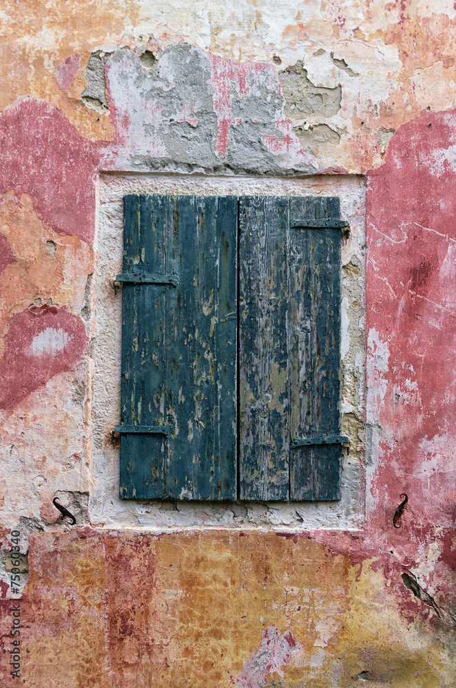Naklejka premium Shutters on a window of an old building in Paxoi island, Greece