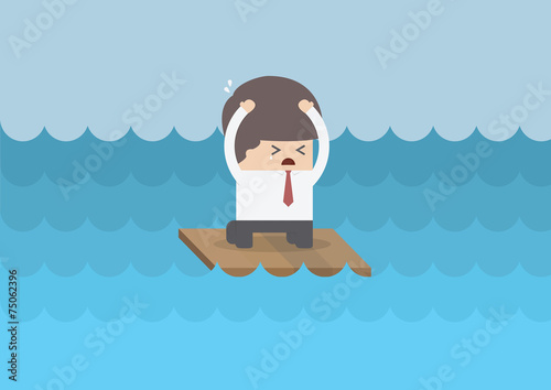 Businessman on a raft in the middle of the sea