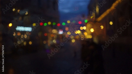 Life in the streets of Riga rainy night in December photo