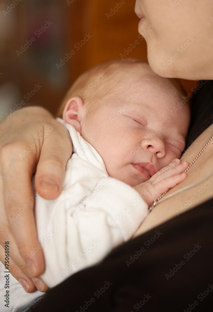 newborn baby in mother's arms newborn baby in mother's arms