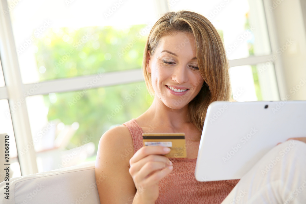 Portrait of woman shopping on internet with tablet Portrait of woman shopping on internet with tablet