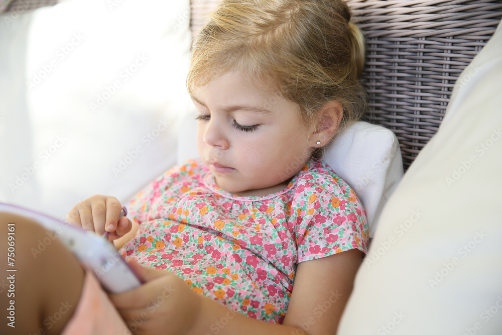 4-year-old kid playing with tablet 4-year-old kid playing with tablet