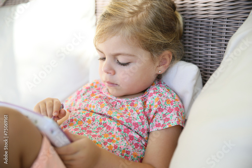 4-year-old kid playing with tablet