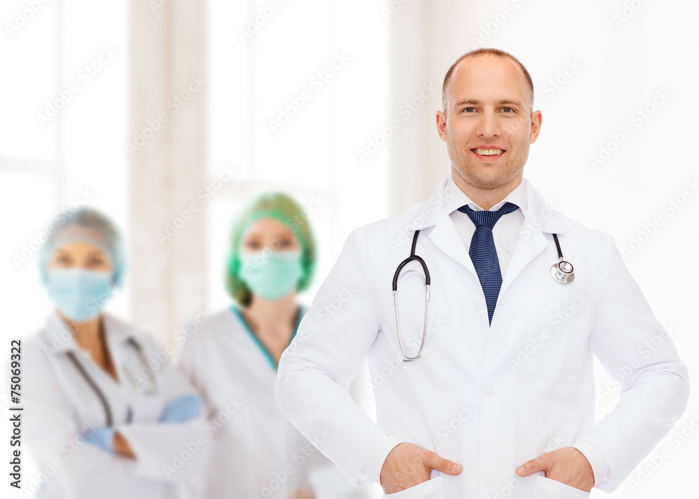 smiling male doctor with stethoscope smiling male doctor with stethoscope