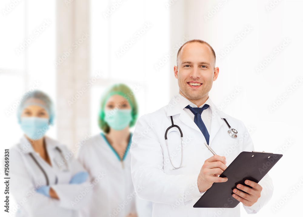 smiling male doctor with clipboard and stethoscope smiling male doctor with clipboard and stethoscope