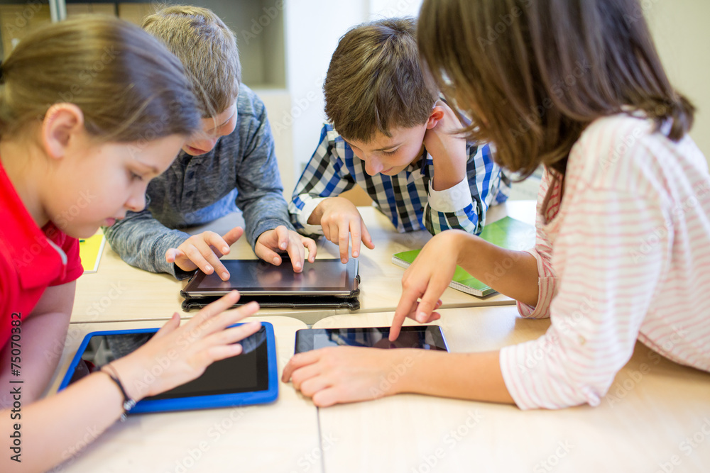 group of school kids with tablet pc in classroom group of school kids with tablet pc in classroom