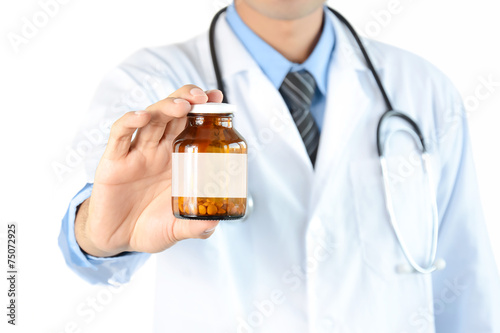 Doctor showing drug or medicine  bottle with blank label