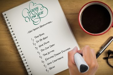Composite image of hand writing with marker