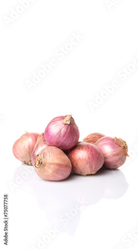 Indian small red onions over white background 