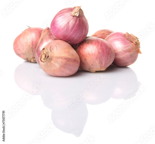 Indian small red onions over white background 