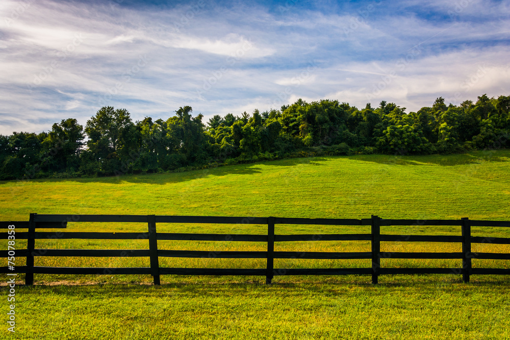 Fence and hill in rural York County, Pennsylvania.