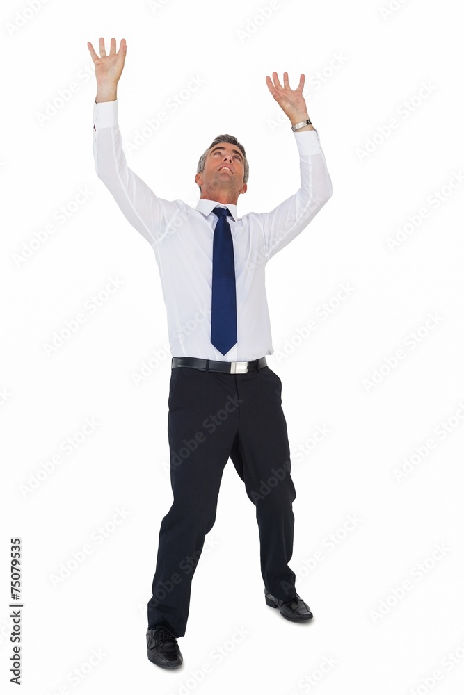 Businessman standing with arms up Businessman standing with arms up