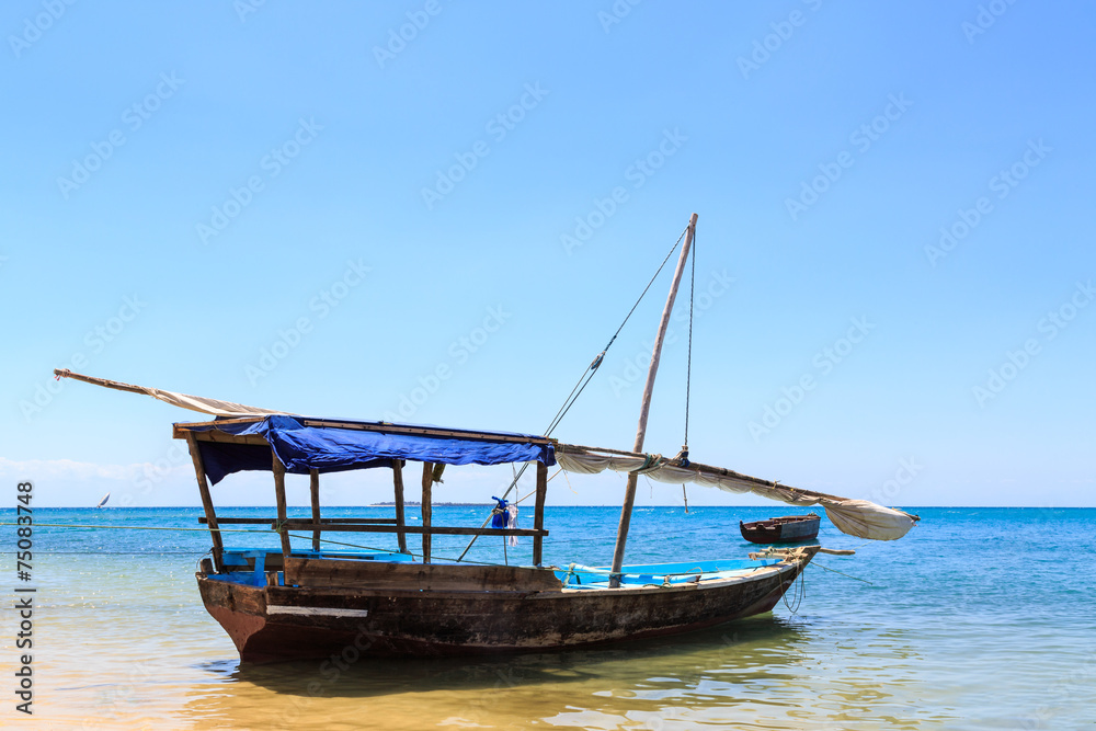 Traditional fisherman boat lying near the beach