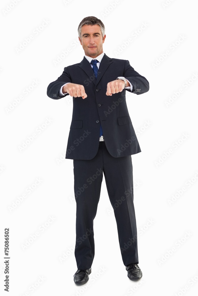 Smiling businessman in suit gesturing Smiling businessman in suit gesturing