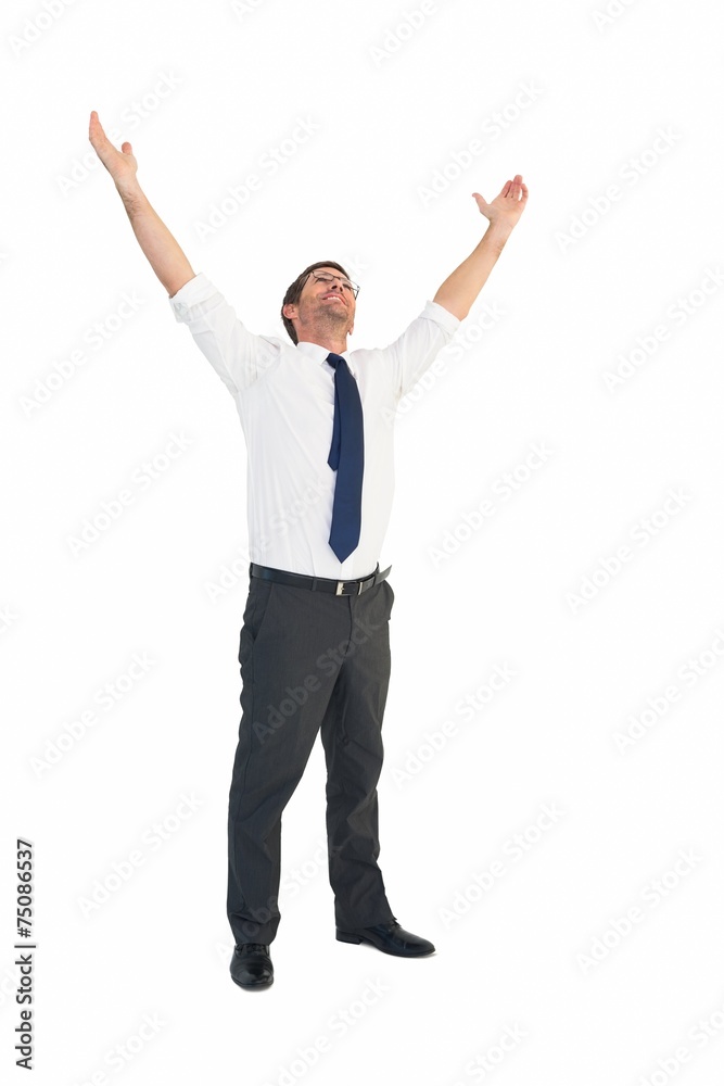 Handsome businessman cheering with arms up
