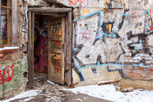 Old courtyard walls painted with colorful graffiti