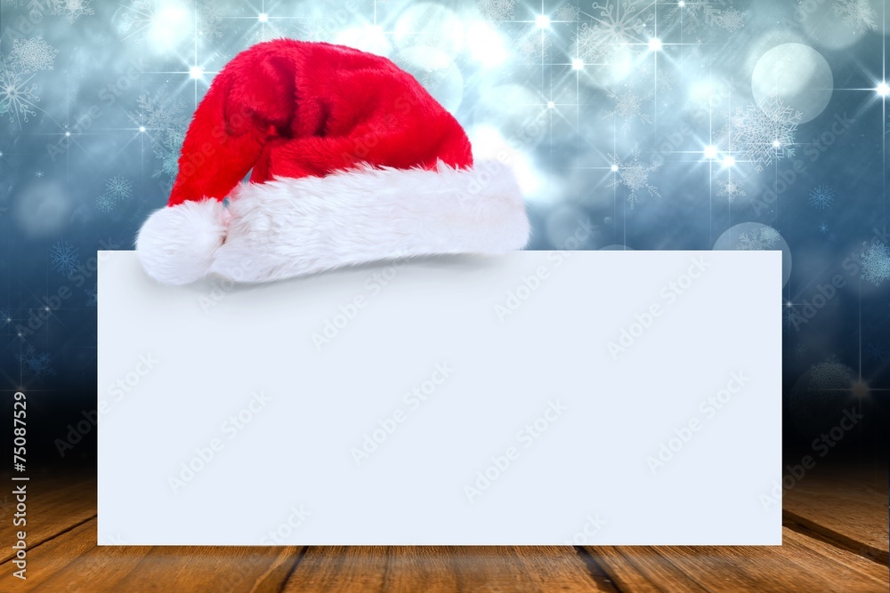 Composite image of santa hat on poster Composite image of santa hat on poster