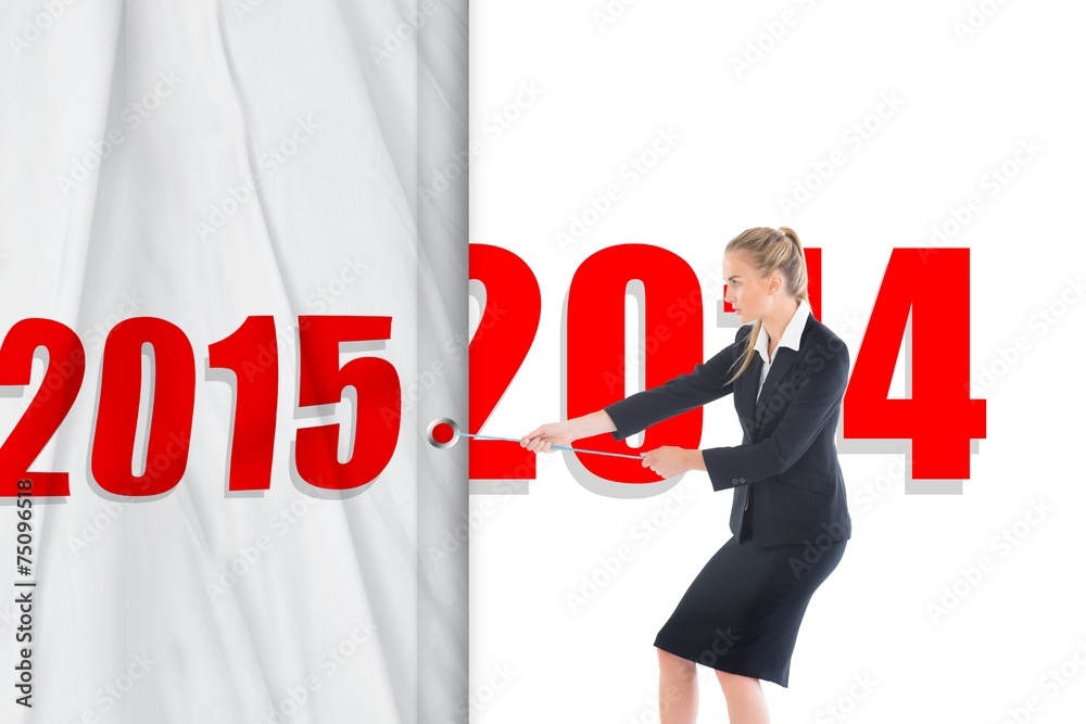 Composite image of focused blonde businesswoman pulling a rope Composite image of focused blonde businesswoman pulling a rope