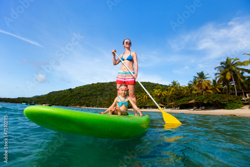 Mother and daughter paddling