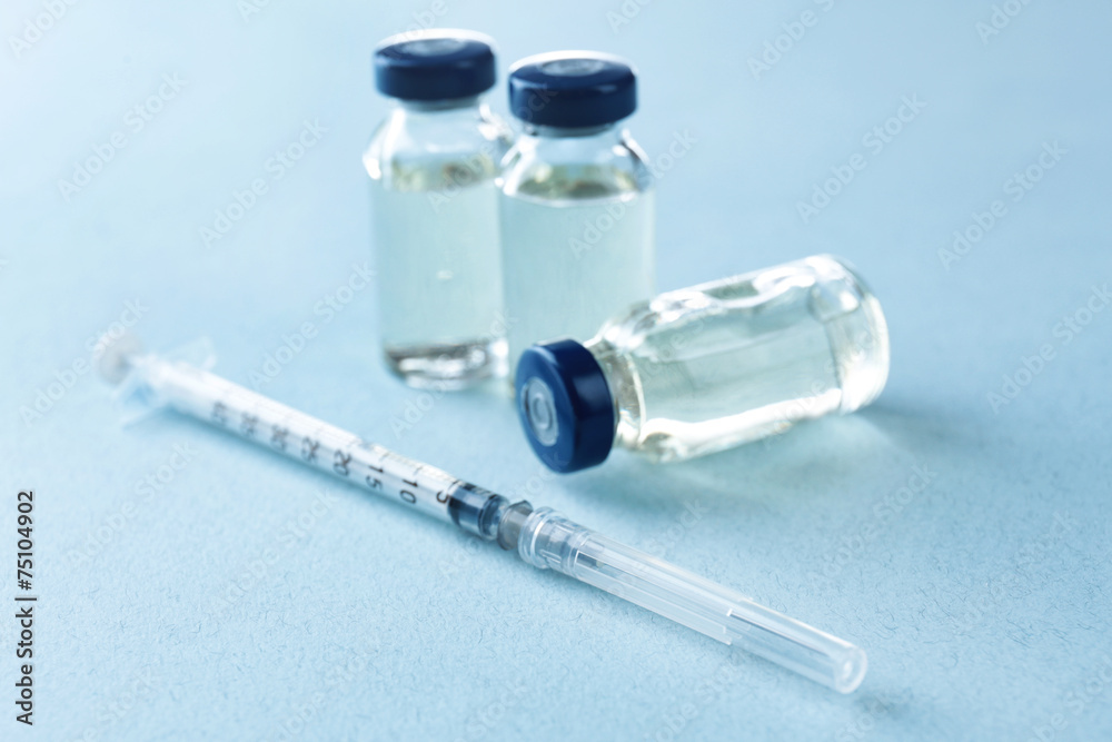 Vaccine in vial with syringe Vaccine in vial with syringe