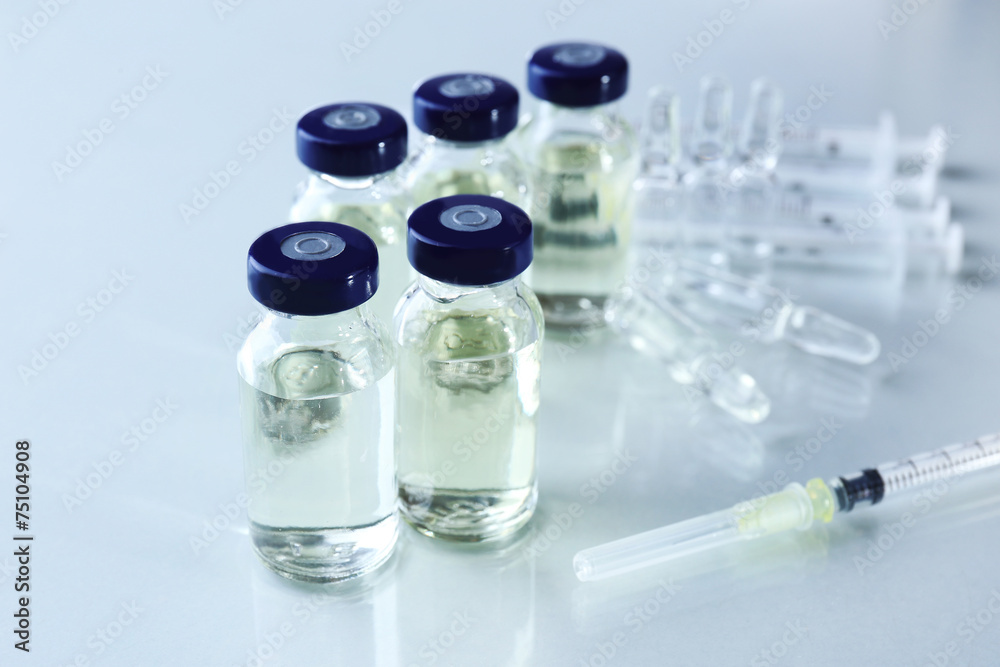 Vaccine in vial with syringe Vaccine in vial with syringe
