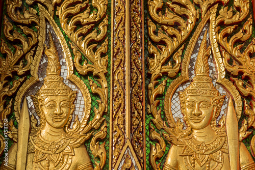 wood carving door decorated in the temple ,Thailand